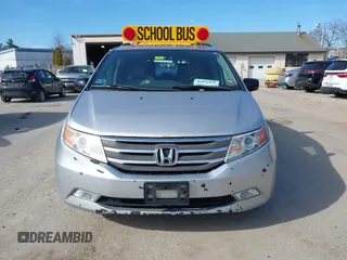 2012 Honda Odyssey Touring with VIN 5FNRL5H95CB063003, listed as a IAAI auction lot 41871975 with 179,332 mi miles and . Bid and sale history available at DreamBid. Image 12.