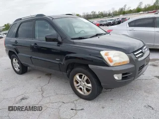 2007 Kia Sportage LX with VIN KNDJE723077397667, listed as a IAAI auction lot 42011122 with 218,744 mi miles and . Bid and sale history available at carsss.com. Image 1.