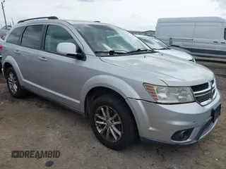2013 Dodge Journey SXT with VIN 3C4PDDBG4DT571469, listed as a IAAI auction lot 42104433 with 166,068 mi miles and . Bid and sale history available at DreamBid. Image 1.