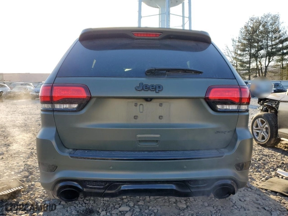 2021 Jeep Grand Cherokee SRT with VIN 1C4RJFDJ5MC718125, listed as a Copart auction lot 88736945 with 54,553 mi miles and Salvage Title. Bid and sale history available at carsss.com. Image 6.