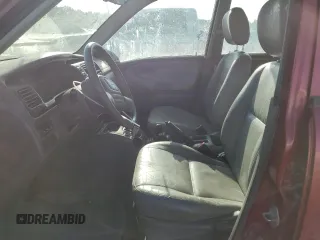 2001 Chevrolet Tracker LT z VIN 2CNBJ634716945832, wystawiony jako Copart lot #61967345 z przebiegiem 136 403 mil mil oraz Szkoda całkowita • Salvage title. Historia ofert i sprzedaży dostępna na DreamBid. Obrazek 7.