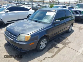 2005 Hyundai Accent GLS z VIN KMHCG35C65U366635, wystawiony jako IAAI lot #42389348 z przebiegiem 65 872 mil mil oraz . Historia ofert i sprzedaży dostępna na DreamBid. Obrazek 2.