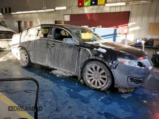 2012 Lincoln MKS с VIN 1LNHL9ER6CG802551, выставлен на аукционе Copart как лот 88782585 с пробегом Не указан миль и Списание • Salvage title. История ставок и продаж доступна на DreamBid. Изображение 4.