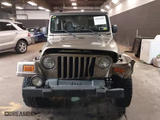 2004 Jeep Wrangler Sahara with VIN 1J4FA59S64P736389, listed as a IAAI auction lot 41432819 with 102,830 mi miles. Bid and sale history available at carsss.com. Image 12.