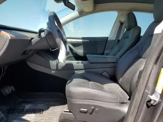 2023 Tesla Model Y Long Range z VIN 7SAYGDEE8PA185193, wystawiony jako Copart lot #48706215 z przebiegiem 10 451 mil mil oraz Szkoda całkowita • Salvage title. Historia ofert i sprzedaży dostępna na DreamBid. Obrazek 7.
