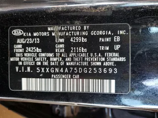 2013 Kia Optima EX z VIN 5XXGN4A75DG253693, wystawiony jako Copart lot #59227785 z przebiegiem 191 062 mil mil oraz Szkoda całkowita • Salvage title. Historia ofert i sprzedaży dostępna na DreamBid. Obrazek 12.