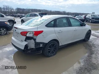 2016 Ford Focus SE z VIN 1FADP3F23GL343651, wystawiony jako IAAI lot #41668112 z przebiegiem 120 891 mil mil oraz . Historia ofert i sprzedaży dostępna na DreamBid. Obrazek 4.