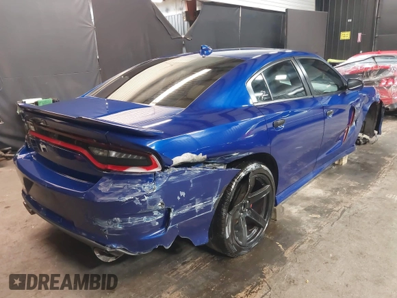 2022 Dodge Charger R/T with VIN 2C3CDXCT9NH127952, listed as a IAAI auction lot 42020401 with 55,483 mi miles and . Bid and sale history available at carsss.com. Image 4.