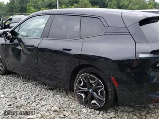 2024 BMW iX xDrive50 with VIN WB523CF09RCP70617, listed as a Copart auction lot 58091014 with 2,539 mi miles and Salvage Title. Bid and sale history available at carsss.com. Image 2.