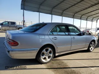 2002 Mercedes-Benz E-Class with VIN WDBJF65J12B488632, listed as a Copart auction lot 87060504 with 273,135 mi miles and Salvage Title. Bid and sale history available at carsss.com. Image 3.