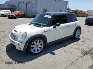 2004 MINI Hardtop S with VIN WMWRE33454TD78702, listed as a Copart auction lot 61276765 with 192,445 mi miles and Salvage title. Bid and sale history available at DreamBid. Image 1.
