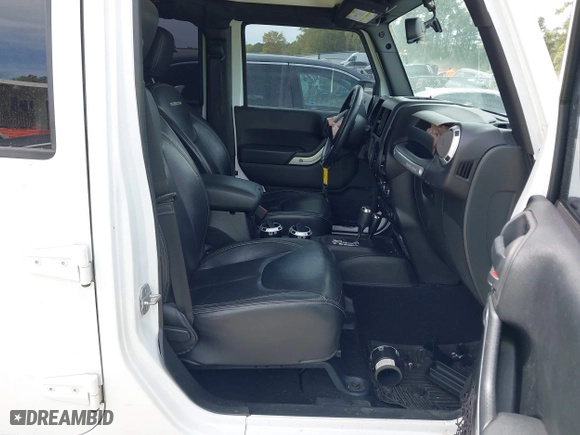 2015 Jeep Wrangler Unlimited Rubicon Hard Rock with VIN 1C4HJWFG7FL684057, listed as a IAAI auction lot 41963885 with 103,240 mi miles. Bid and sale history available at carsss.com. Image 5.
