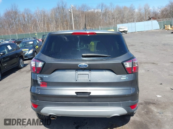 2017 Ford Escape SE with VIN 1FMCU9GD5HUC17297, listed as a IAAI auction lot 41880013 with 57,737 mi miles and . Bid and sale history available at DreamBid. Image 16.