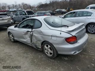 2001 Hyundai Tiburon with VIN KMHJG35F31U224416, listed as a Copart auction lot 83243684 with 59,473 mi miles and Salvage Title. Bid and sale history available at carsss.com. Image 2.