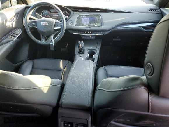 2023 Cadillac XT4 FWD Luxury with VIN 1GYAZAR49PF102307, listed as a Copart auction lot 49342465 with 21,093 mi miles and Salvage Title. Bid and sale history available at DreamBid. Image 8.