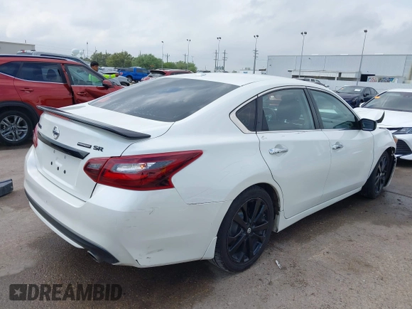 2018 Nissan Altima SR with VIN 1N4AL3AP3JC290863, listed as a IAAI auction lot 41933628 with 121,771 mi miles and . Bid and sale history available at carsss.com. Image 4.