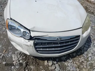2005 Chrysler Sebring z VIN 1C3EL46X65N541688, wystawiony jako IAAI lot #42375607 z przebiegiem 220 495 mil mil oraz . Historia ofert i sprzedaży dostępna na DreamBid. Obrazek 6.