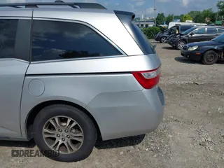 2012 Honda Odyssey EX-L with VIN 5FNRL5H61CB081634, listed as a IAAI auction lot 42760909 with 197,949 mi miles and . Bid and sale history available at DreamBid. Image 12.