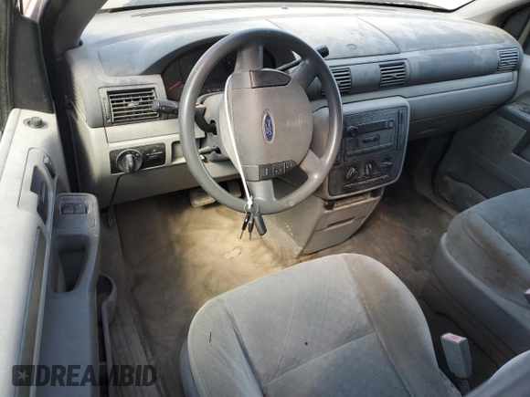 2007 Ford Freestar Cargo z VIN 2FTZA54647BA13617, wystawiony jako Copart lot #52545745 z przebiegiem Nie podano mil oraz Szkody całkowita. Historia ofert i sprzedaży dostępna na DreamBid. Obrazek 8.
