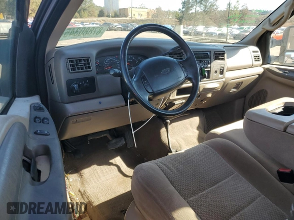 2002 Ford F-250 XL with VIN 1FTNF21L02EA83007, listed as a Copart auction lot 87880345 with 104,889 mi miles and Salvage title. Bid and sale history available at DreamBid. Image 8.
