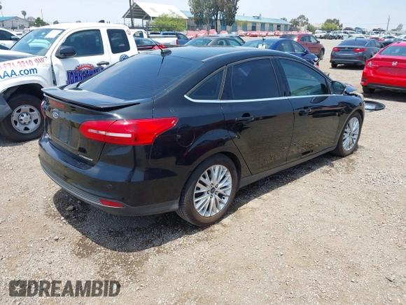 2016 Ford Focus Titanium z VIN 1FADP3J20GL310467, wystawiony jako IAAI lot #42478332 z przebiegiem 214 479 mil mil oraz . Historia ofert i sprzedaży dostępna na DreamBid. Obrazek 4.