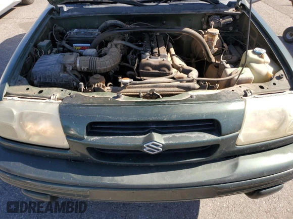 2000 Suzuki Vitara JX z VIN 2S3TD52V1Y6108459, wystawiony jako Copart lot #75526644 z przebiegiem 263 433 mil mil oraz Szkody całkowita. Historia ofert i sprzedaży dostępna na DreamBid. Obrazek 12.