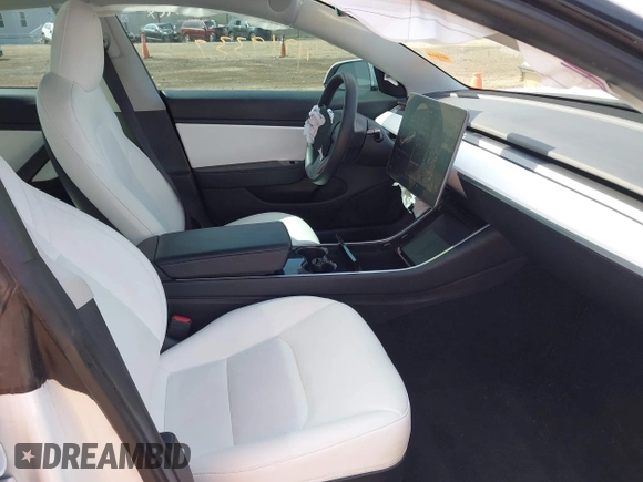 2020 Tesla Model 3 Standard Range Plus with VIN 5YJ3E1EA3LF785951, listed as a IAAI auction lot 41919339 with 63,025 mi miles and . Bid and sale history available at carsss.com. Image 5.