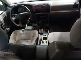 2004 Isuzu Rodeo S z VIN 4S2CK58W144306785, wystawiony jako Copart lot #85124684 z przebiegiem 296 433 mil mil oraz Szkody całkowita. Historia ofert i sprzedaży dostępna na DreamBid. Obrazek 8.