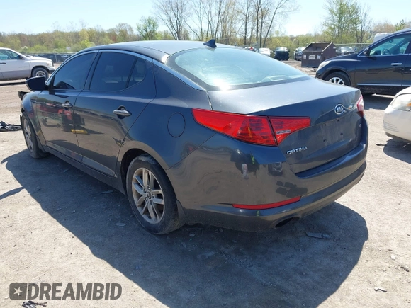 2011 Kia Optima LX with VIN KNAGM4A71B5061995, listed as a IAAI auction lot 42129683 with 207,110 mi miles and . Bid and sale history available at carsss.com. Image 3.