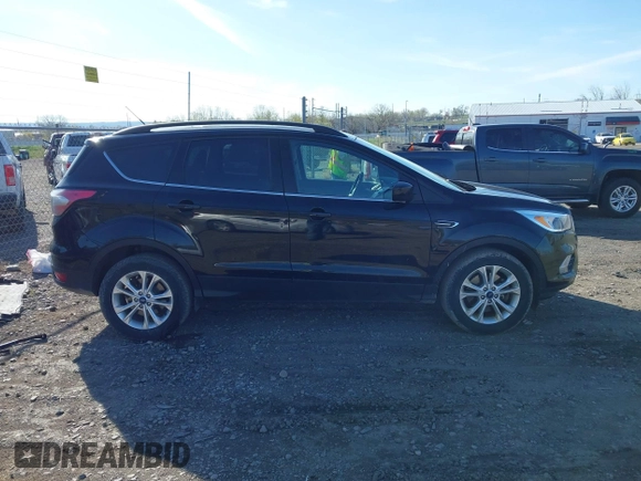 2018 Ford Escape SE z VIN 1FMCU9GD5JUB15259, wystawiony jako IAAI lot #42182040 z przebiegiem 122 194 mil mil oraz . Historia ofert i sprzedaży dostępna na DreamBid. Obrazek 14.