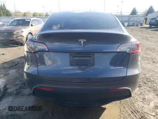 2023 Tesla Model Y Long Range z VIN 7SAYGAEE3PF596826, wystawiony jako Copart lot #50513045 z przebiegiem 30 747 mil mil oraz Szkoda całkowita • Salvage title. Historia ofert i sprzedaży dostępna na DreamBid. Obrazek 6.