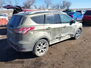 2014 Ford Escape Titanium with VIN 1FMCU9J96EUA15990, listed as a IAAI auction lot 41667046 with 203,202 mi miles. Bid and sale history available at carsss.com. Image 4.