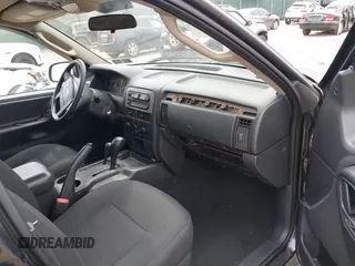 2004 Jeep Grand Cherokee Laredo z VIN 1J4GW48S54C198115, wystawiony jako IAAI lot #42351240 z przebiegiem 189 416 mil mil oraz . Historia ofert i sprzedaży dostępna na DreamBid. Obrazek 5.