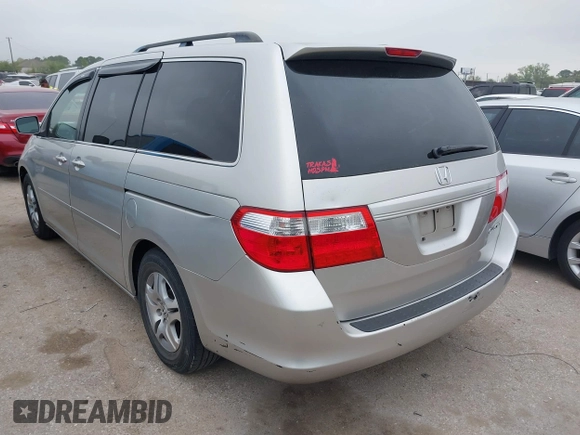 2005 Honda Odyssey EX-L with VIN 5FNRL38625B421123, listed as a IAAI auction lot 41886027 with 174,459 mi miles. Bid and sale history available at carsss.com. Image 3.