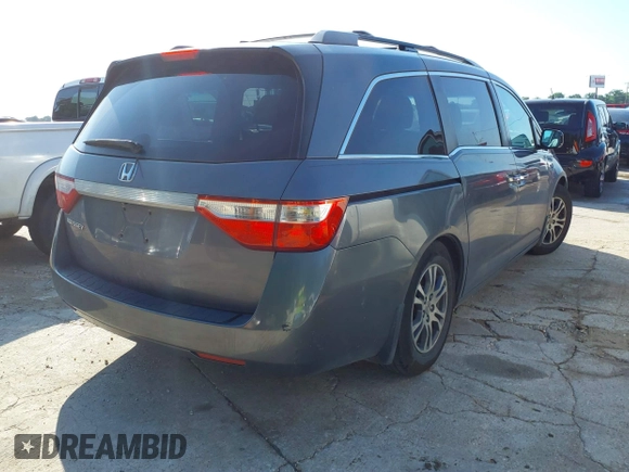 2011 Honda Odyssey EX-L with VIN 5FNRL5H6XBB073482, listed as a IAAI auction lot 42090463 with 213,061 mi miles and . Bid and sale history available at carsss.com. Image 4.