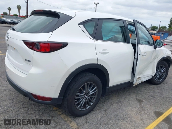 2019 Mazda CX-5 Sport with VIN JM3KFABM4K1565787, listed as a IAAI auction lot 42054585 with 80,580 mi miles and . Bid and sale history available at DreamBid. Image 4.