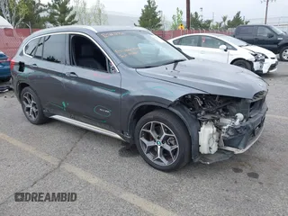 2016 BMW X1 xDrive28i with VIN WBXHT3C32GP886084, listed as a IAAI auction lot 41895754 with 85,662 mi miles. Bid and sale history available at carsss.com. Image 1.