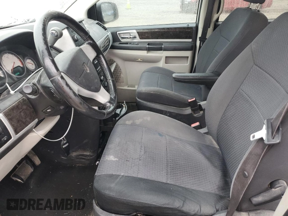 2010 Dodge Grand Caravan SXT with VIN 2D4RN5D12AR244722, listed as a Copart auction lot 43725005 with 210,546 mi miles and Clean Title. Bid and sale history available at DreamBid. Image 7.