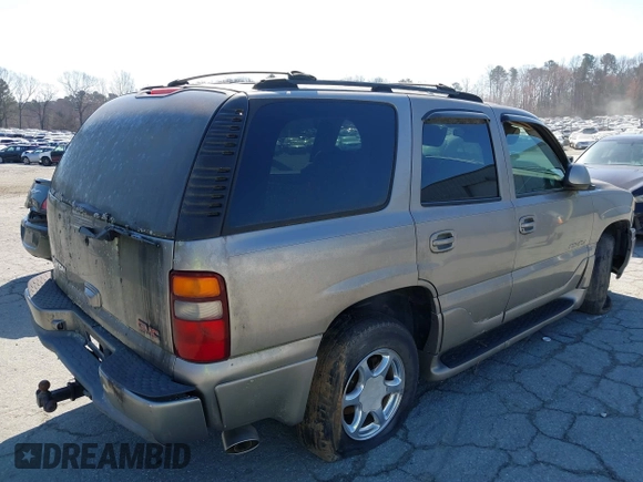 2002 GMC Yukon Denali z VIN 1GKEK63U82J341696, wystawiony jako IAAI lot #41772116 z przebiegiem 259 337 mil mil oraz . Historia ofert i sprzedaży dostępna na DreamBid. Obrazek 4.