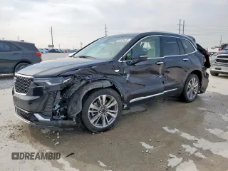 2022 Cadillac XT6 Premium Luxury z VIN 1GYKPCRS9NZ107393, wystawiony jako Copart lot #51529635 z przebiegiem 33 004 mil mil oraz Nie do naprawy • Non repairable. Historia ofert i sprzedaży dostępna na DreamBid. Obrazek 1.