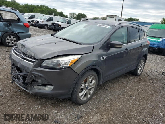 2015 Ford Escape Titanium with VIN 1FMCU9J96FUB32972, listed as a Copart auction lot 62886145 with 215,769 mi miles and Salvage title. Bid and sale history available at DreamBid. Image 1.