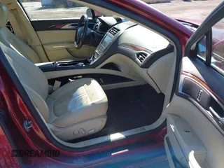 2015 Lincoln MKZ Hybrid with VIN 3LN6L2LUXFR606101, listed as a IAAI auction lot 41668806 with 77,112 mi miles. Bid and sale history available at carsss.com. Image 5.
