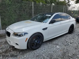 2015 BMW M5 with VIN WBSFV9C5XFD595229, listed as a Copart auction lot 63020514 with 0 mi miles and Salvage Title. Bid and sale history available at carsss.com. Image 1.