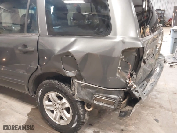 2005 Honda Pilot EX-L with RES with VIN 2HKYF18655H521175, listed as a IAAI auction lot 41490812 with 357,033 mi miles. Bid and sale history available at carsss.com. Image 6.