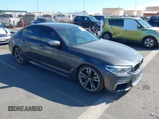 2018 BMW 5 Series M550i xDrive with VIN WBAJB9C51JB049513, listed as a IAAI auction lot 41146990 with 51,218 mi miles. Bid and sale history available at carsss.com. Image 1.
