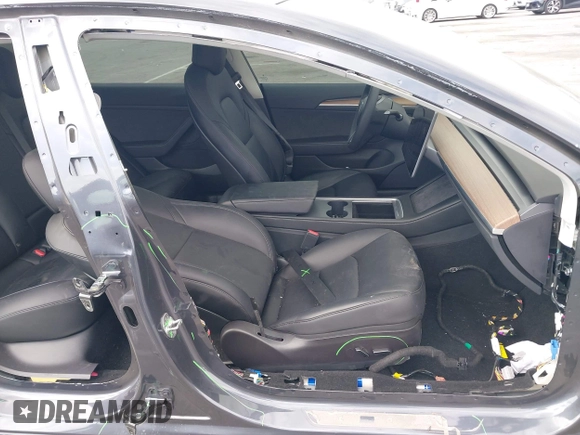 2023 Tesla Model 3 with VIN 5YJ3E1EA4PF410060, listed as a IAAI auction lot 42067624 with 59,934 mi miles and . Bid and sale history available at DreamBid. Image 5.