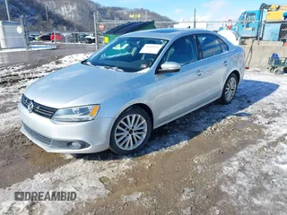 2014 Volkswagen Jetta TDI w/Premium/Nav z VIN 3VWLL7AJXEM382611, wystawiony jako IAAI lot #41609335 z przebiegiem 120 000 mil mil oraz . Historia ofert i sprzedaży dostępna na DreamBid. Obrazek 2.