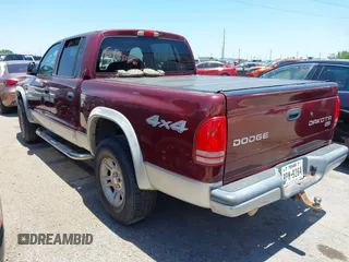 2003 Dodge Dakota SLT with VIN 1D7HG48N43S256520, listed as a IAAI auction lot 42111997 with 218,061 mi miles and . Bid and sale history available at carsss.com. Image 3.