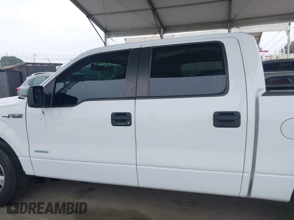 2014 Ford F-150 XL with VIN 1FTFW1CT1EKE22892, listed as a IAAI auction lot 42172851 with 14,203 mi miles and . Bid and sale history available at DreamBid. Image 14.