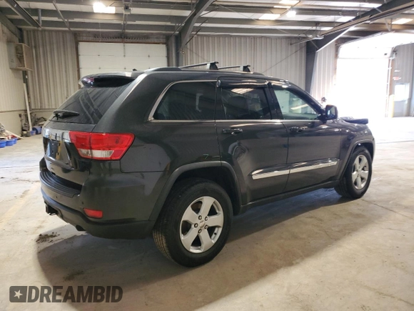 2011 Jeep Grand Cherokee Laredo with VIN 1J4RS4GG9BC517059, listed as a Copart auction lot 52704705 with 120,171 mi miles and Salvage Title. Bid and sale history available at DreamBid. Image 3.